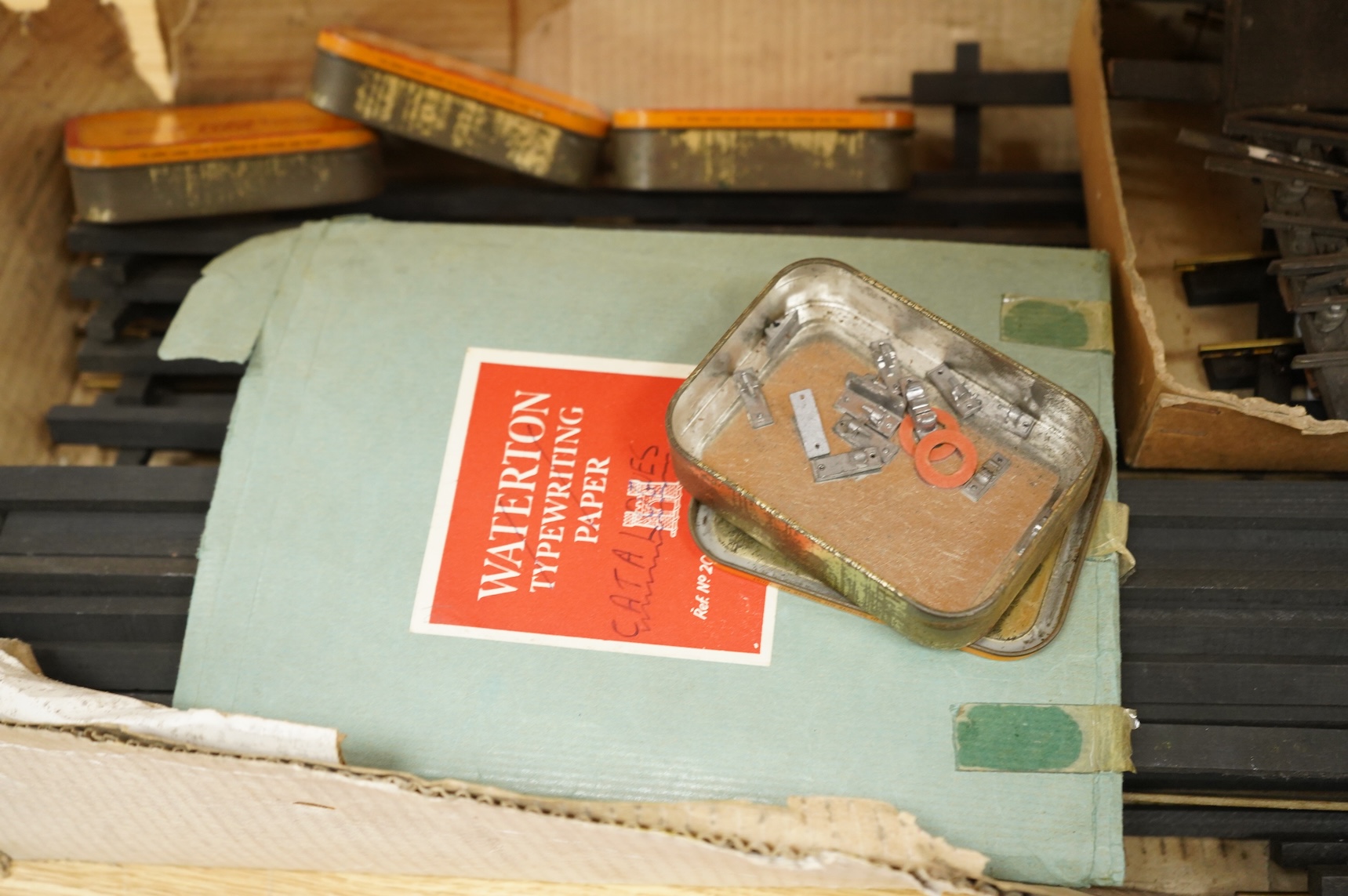 A quantity of 1930s-50s Bassett Lowke 0 gauge railway related track parts and accessories, including track sections on wooden sleepers, a Bassett-Lowke set of points, plus two handmade sets of points, track gauges, chair